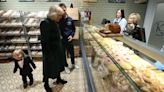 Belfast boy ‘steals the show’ as Queen visits local bakery