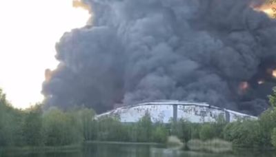 Massive black plumes of smoke seen 'from 20 miles away' after blaze