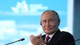 Putin, with a wry smile, says Russia backs Kamala Harris in US election