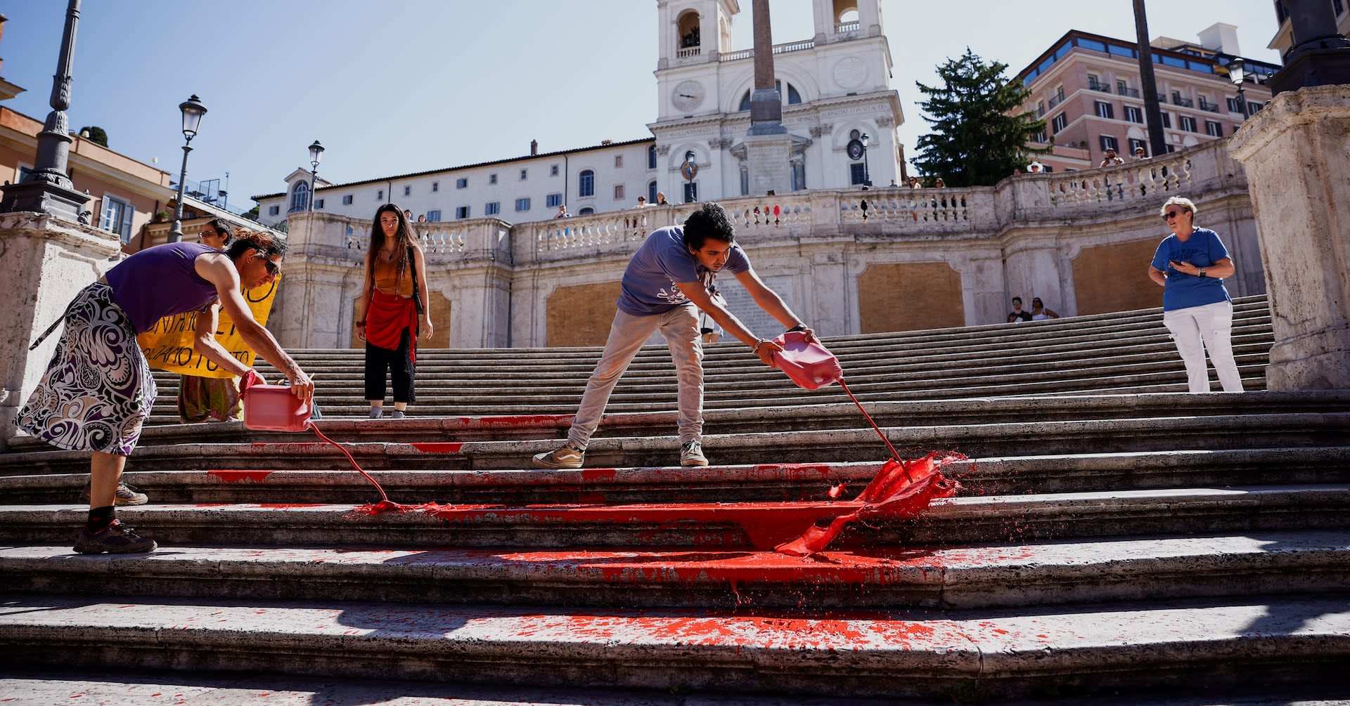 Women's rights activists cover Rome's Spanish Steps in red paint