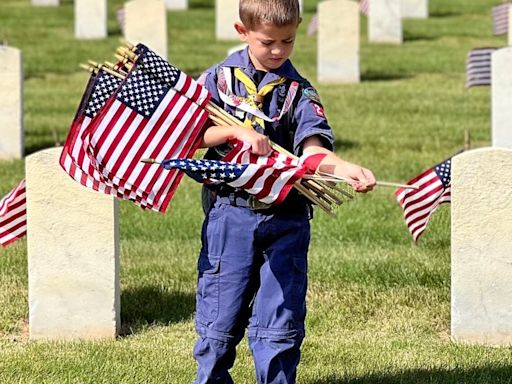 Scouts honor veterans ahead of Memorial Day at Dayton National Cemetery