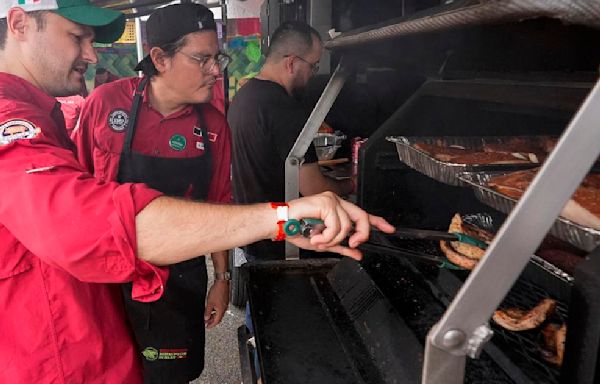 At the 'Super Bowl of Swine,' global barbecuing traditions are the wood-smoked flavor of the day