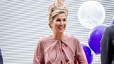Queen Maxima of the Netherlands Opts for Whimsical Dressing in Playful Dusty Rose Dress and Floral Hat at Amsterdam College