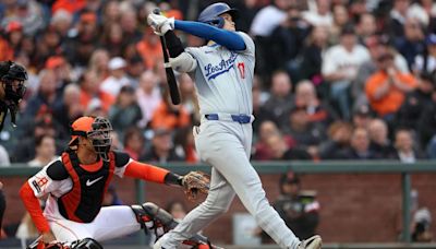 Shohei Ohtani of the Los Angeles Dodgers hits a solo home run against the San Francisco Giants in the fourth inning at Oracle Park on Tuesday, May 14...