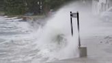 Storm hits Australia with strong winds and power outages, but weakens from cyclone to tropical storm