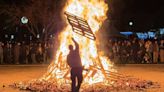 Paso Robles rings in the new year with a giant bonfire and party. See the photos