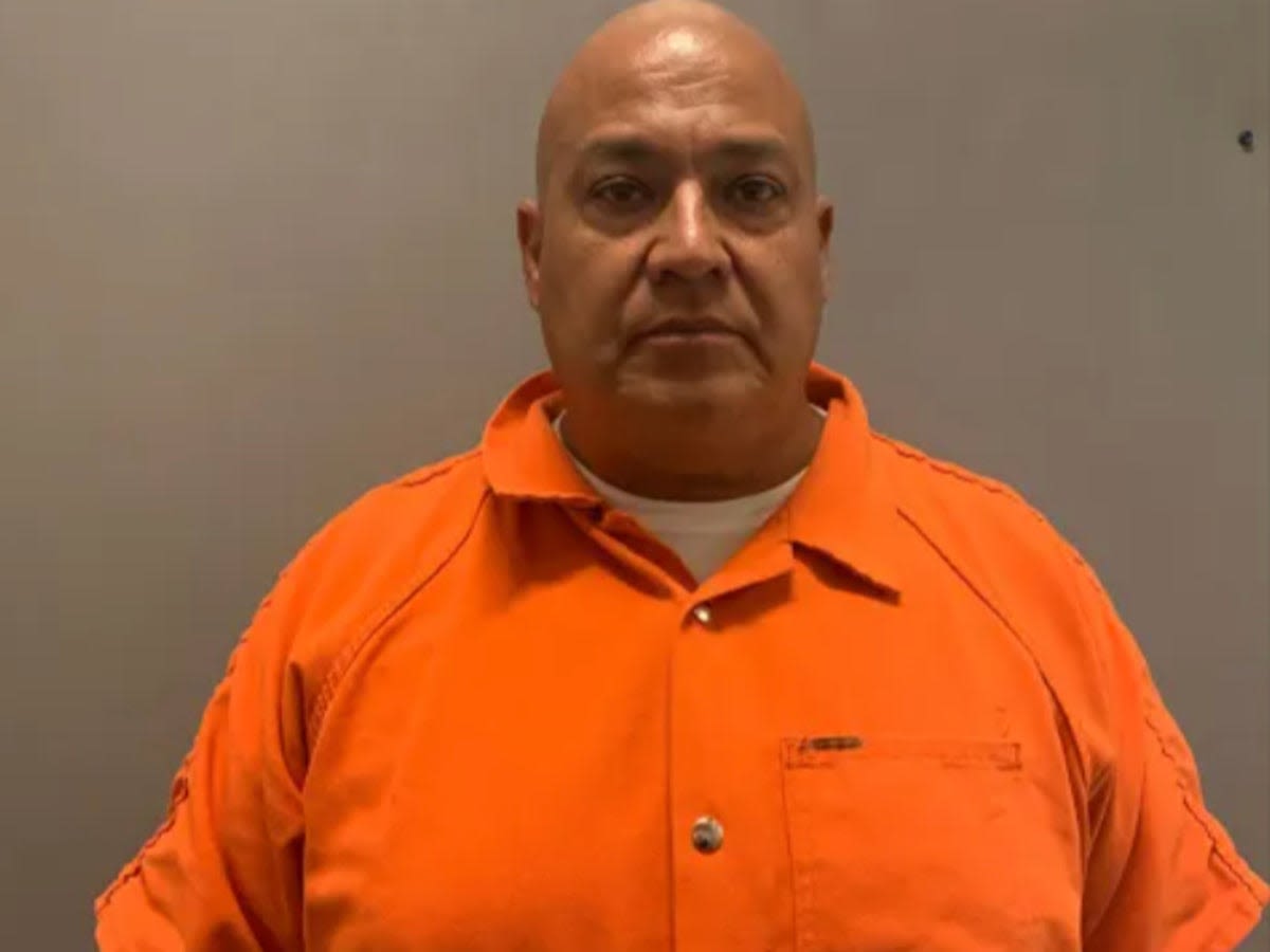 Uvalde school police chief pictured in orange jumpsuit as he’s charged over mass shooting which left 21 dead