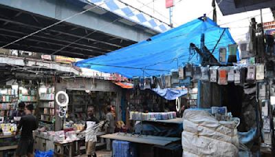 Plastic sheets are back in hawkers’ stalls across the city despite a ban on their use