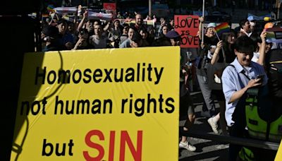 Top South Korea court hands gay couple 'historic' win on spouse rights