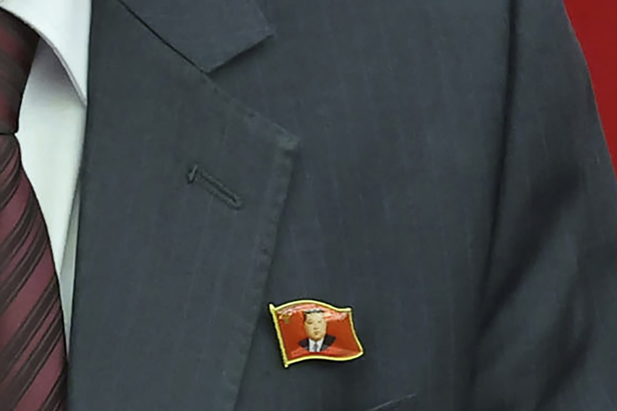 North Koreans are seen wearing Kim Jong Un pins for the first time as his personality cult grows - WTOP News