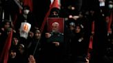 Bombings hit event for Iran's Gen. Qassem Soleimani, a shadowy figure slain in 2020 US drone strike