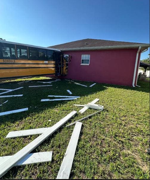 Empty school bus is hit by a pickup truck, then crashes into a Marion Oaks house