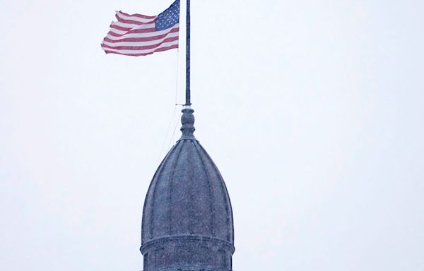 Why are flags flying at half-staff in Wisconsin today?