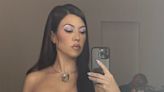 Kourtney Kardashian Claps Back at Pregnancy Comment While Posing in Lingerie