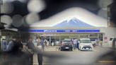 A Japanese town finds holes in a screen built to prevent tourists from snapping photos of Mount Fuji