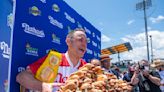 How many calories does a hot dog eating contest champ consume?