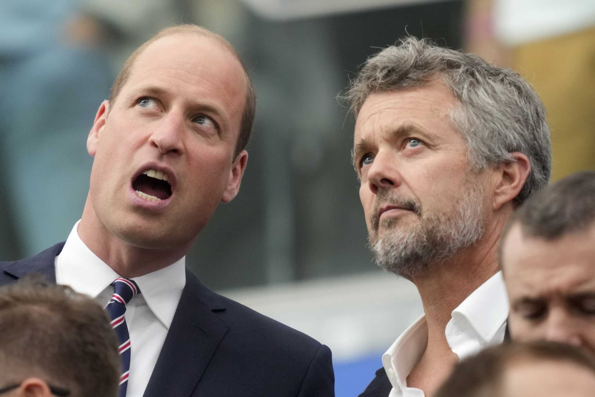 King of Denmark and future king of England join soccer fans at their countries' game at Euro 2024