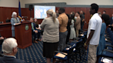 24 people become American citizens in ceremony at New Hampshire State Archives