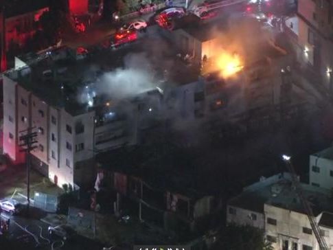 Fire crews work to put out flames in Chinatown apartment buildings, 3 injured, 1 critical