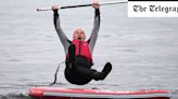 Ed Davey falls into lake five times while campaigning from paddleboard