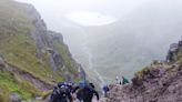 Cork dentists brave ‘challenging’ conditions to climb Carrauntoohill to raise funds for charity