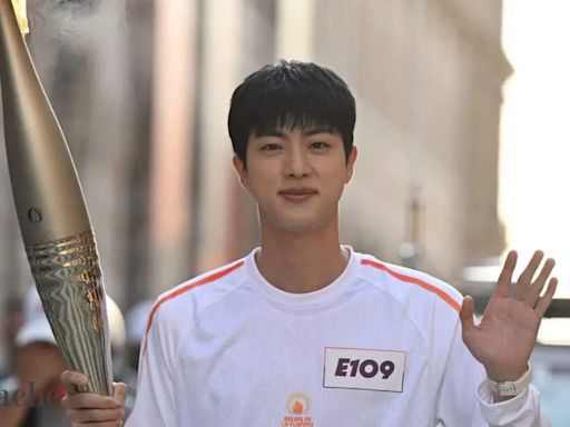 BTS’ Jin makes ARMY proud as he becomes the 1st Korean artist to lift the Olympic Torch! - The Economic Times