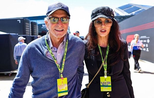 Michael Douglas and Catherine Zeta-Jones pack on the PDA at Grand Prix