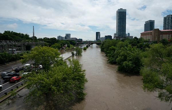 Flooding on highway in Toronto as torrential rain hits city