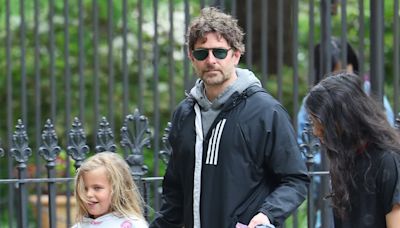 Bradley Cooper holds his daughter Lea's hand in New York City