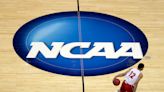 NCAA votes to accept $2.8 billion settlement that paves the way for schools to pay their athletes