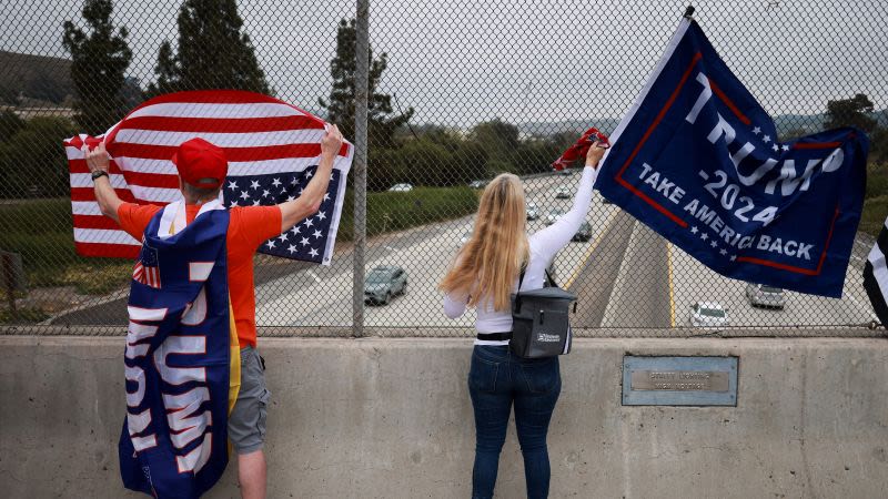 Trump fans turn US flags upside down to protest former president’s conviction | CNN Politics