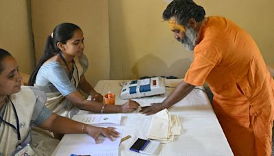 Photos: Lone Indian voter casts ballot in special forest booth