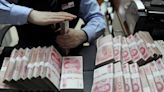 China steps in to stem yuan slide, shore up confidence