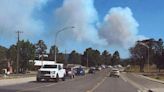 New Mexico village evacuated as quick-moving wildfires close in