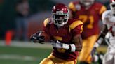 Reggie Bush reacts after Heisman Trophy reinstated