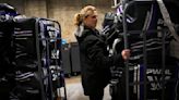 Natalie Darwitz, general manager of the PWHL's Minnesota team, loads the team's duffel bags onto an elevator at the PWHL locker rooms at TRIA practice rink on Thursday, Jan. 25, 2024, in ...