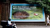 Artists target Wimbledon with graphic mock adverts over Barclays sponsorship