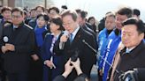 South Korean opposition leader Lee Jae-myung stabbed in neck as he speaks to reporters