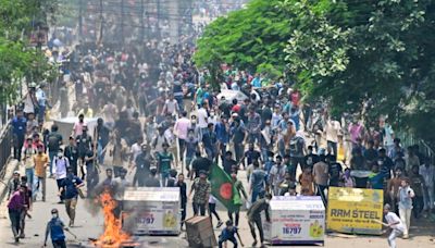 Bangladesh protesters set fire to state TV headquarters