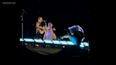 Demonstrator tries to climb on stage at Coldplay concert, falls