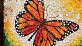 Monarch butterfly art made of plastic bottle caps on display in Antigo