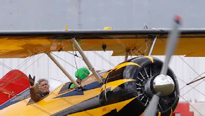 Tom Cruise hangs off the side of a plane for Mission Impossible