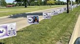 Personalized signs honoring Woodhaven graduates line Hall Road