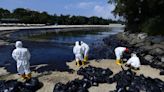 Oil spill blackens parts of Singapore coastline