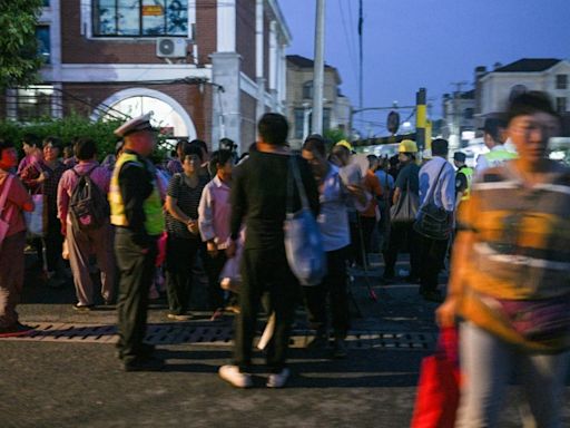 Day labourers seek dwindling jobs pre-dawn in Shanghai suburb