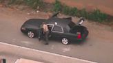 Pursuit driver and passenger abandon car on 5 Freeway in Downey