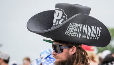 People wore oversized cowboy hats and Halloween masks, among other things, at 108th Indy 500