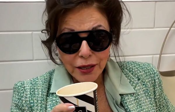 Joan Collins enjoys break from shopping as she sips on latte at Marks and Spencer café