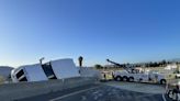 Overturned strawberry truck causes jam on two highways