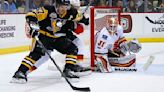 Flames in action against the Penguins following overtime victory